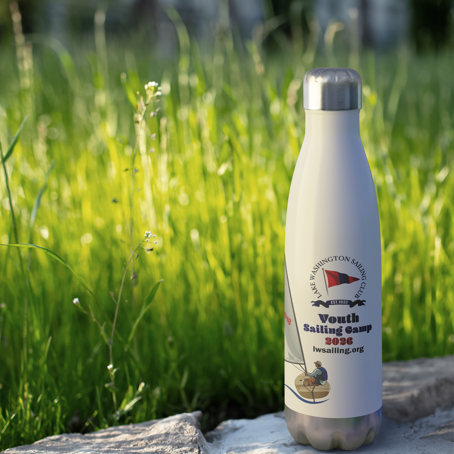 LWSC_El_Toro_Sailboat_Water_Bottle_WaterBottle_Outdoor_grass_Mockup.png_15928018